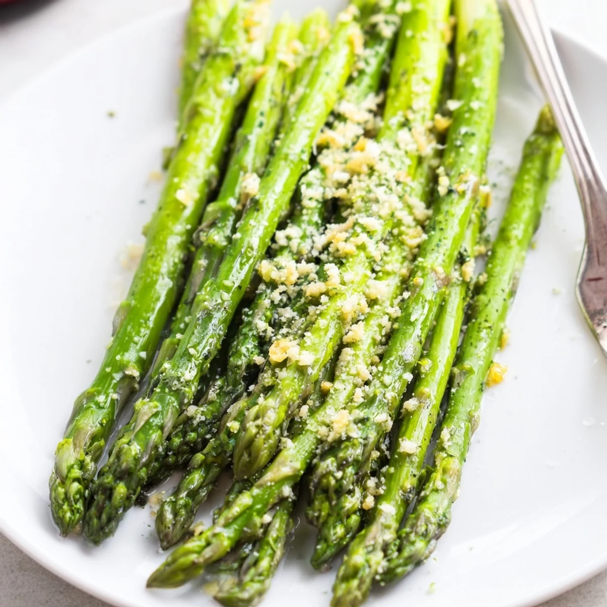 A vibrant Lemon Garlic Asparagus with Grated Parmesan served warm as an elegant spring side dish.