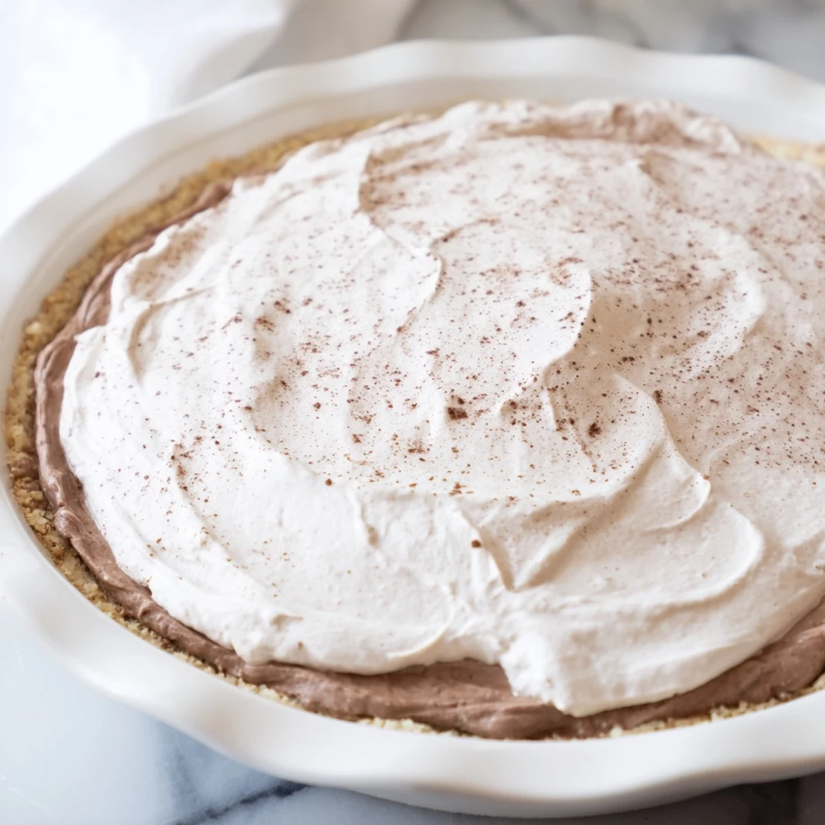 Close-up of the Keto Cold Brew Coffee Pie revealing its smooth filling and almond flour crust texture.
