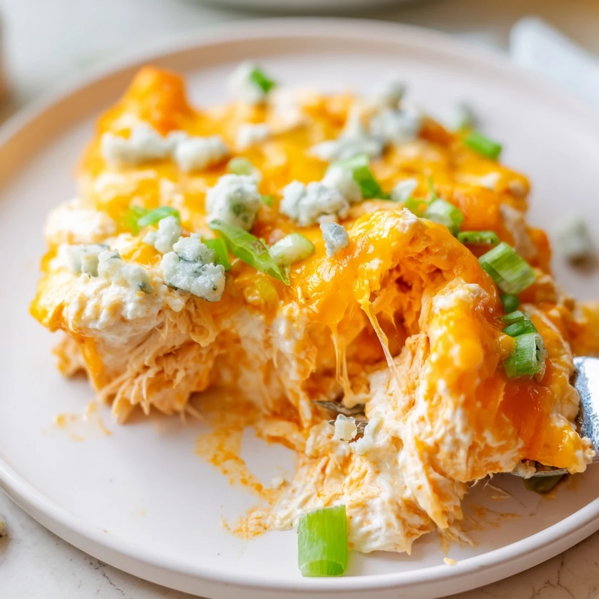 A skillet of Keto Buffalo Chicken Dip is ready to serve, ideal for game day gatherings and low carb parties.
