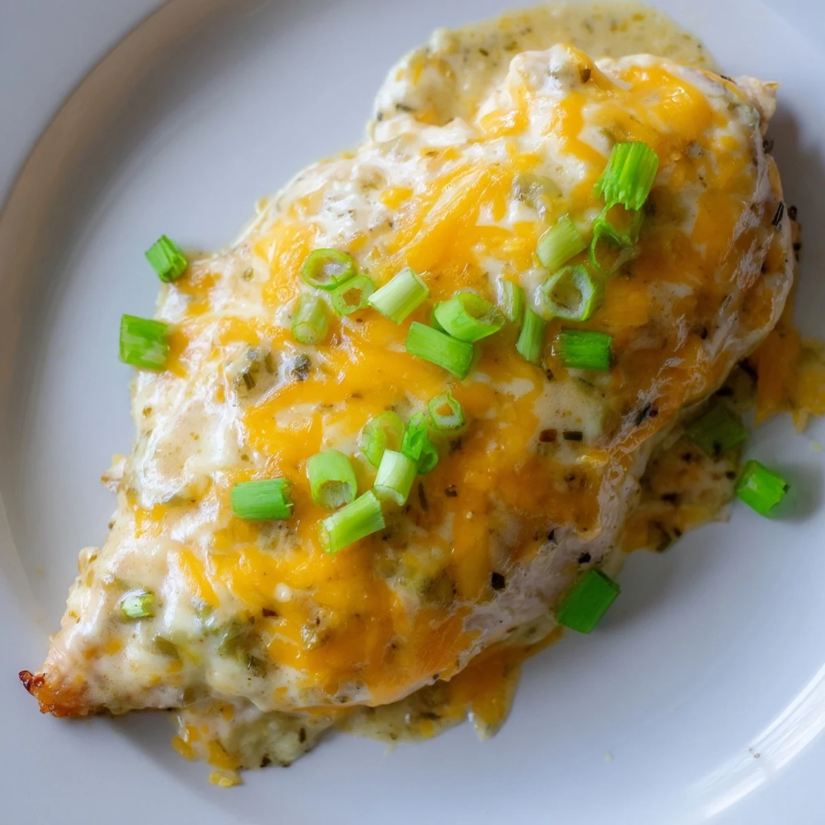 This comforting Sour Cream and Onion Chicken is golden and bubbly, perfect for a weeknight family dinner.