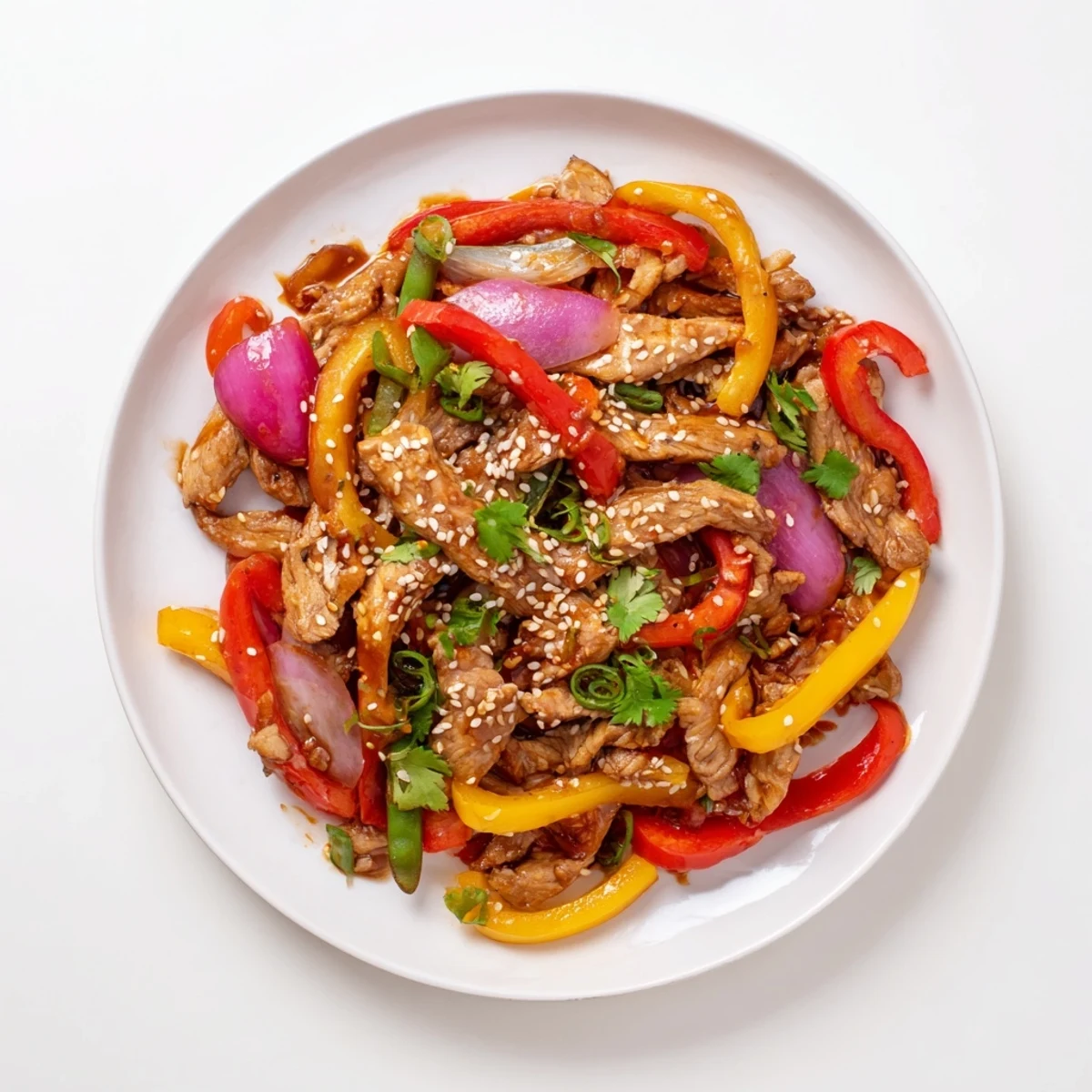 Sizzling Quick Sweet Chilli Chicken Stir Fry in a wok with garlic and ginger aromatics.