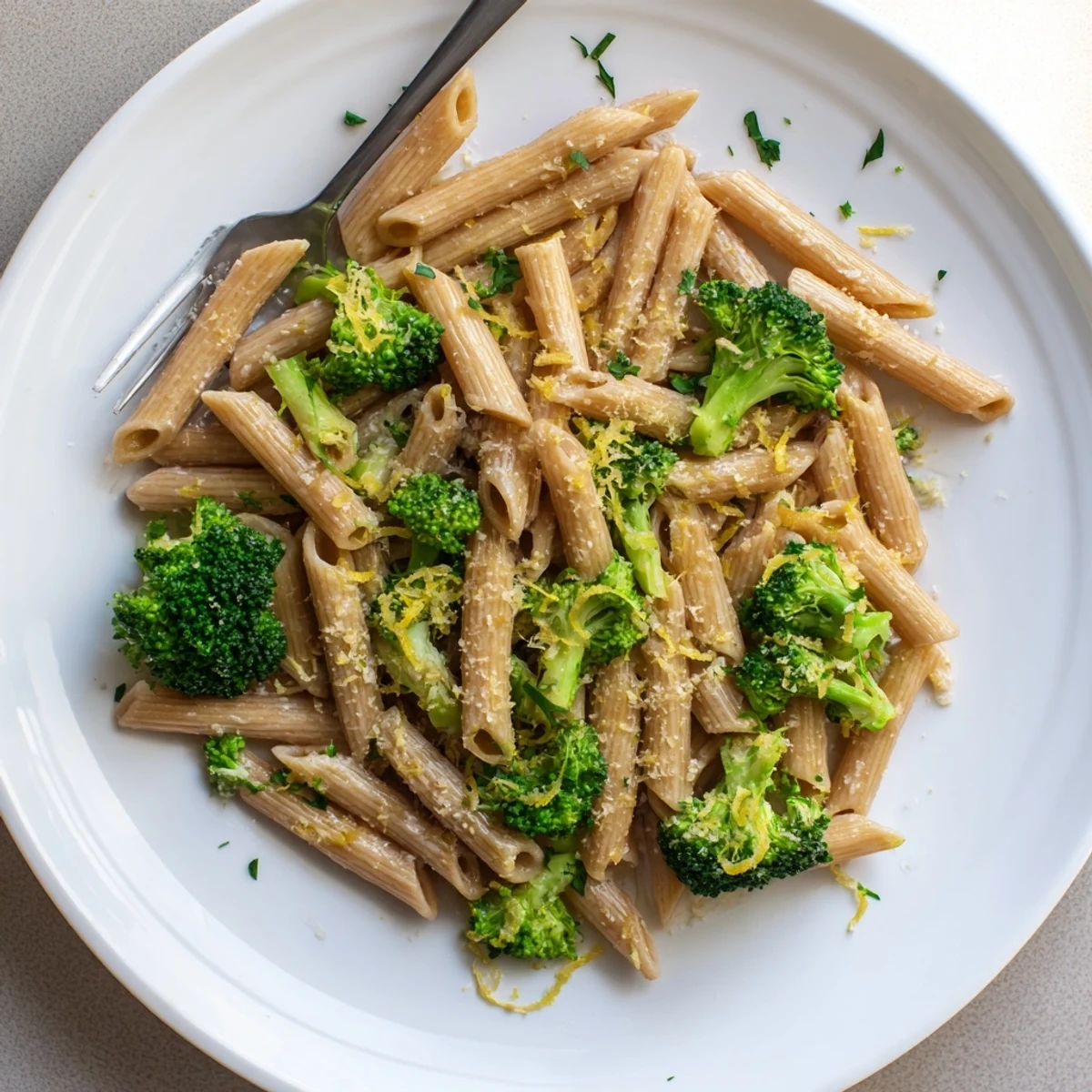 Sizzling skillet of Easy Healthy Broccoli Pasta with garlic, red pepper flakes, and tender veggies.