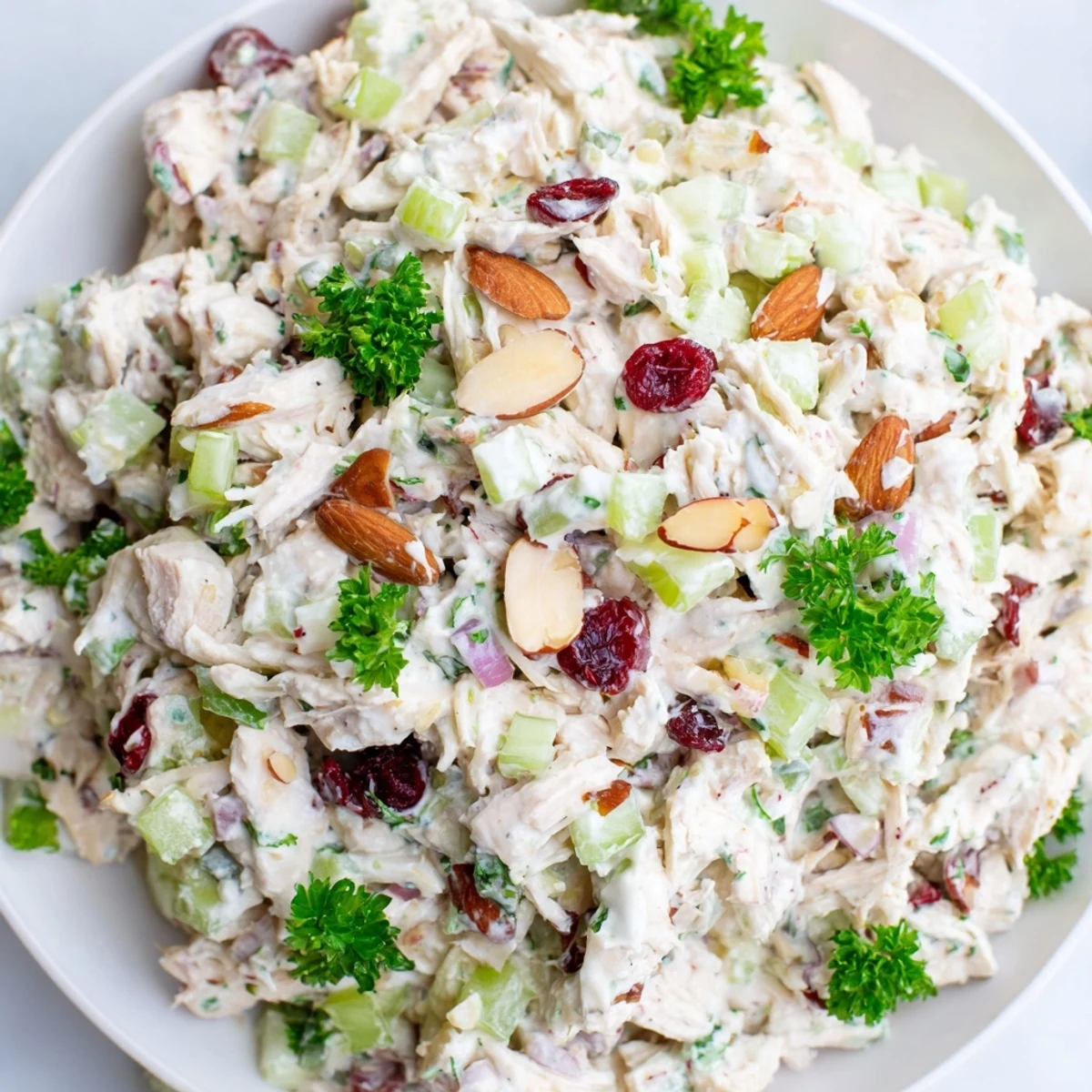 Healthy chicken salad featuring tender rotisserie meat mixed with crunchy celery and tangy Greek yogurt dressing