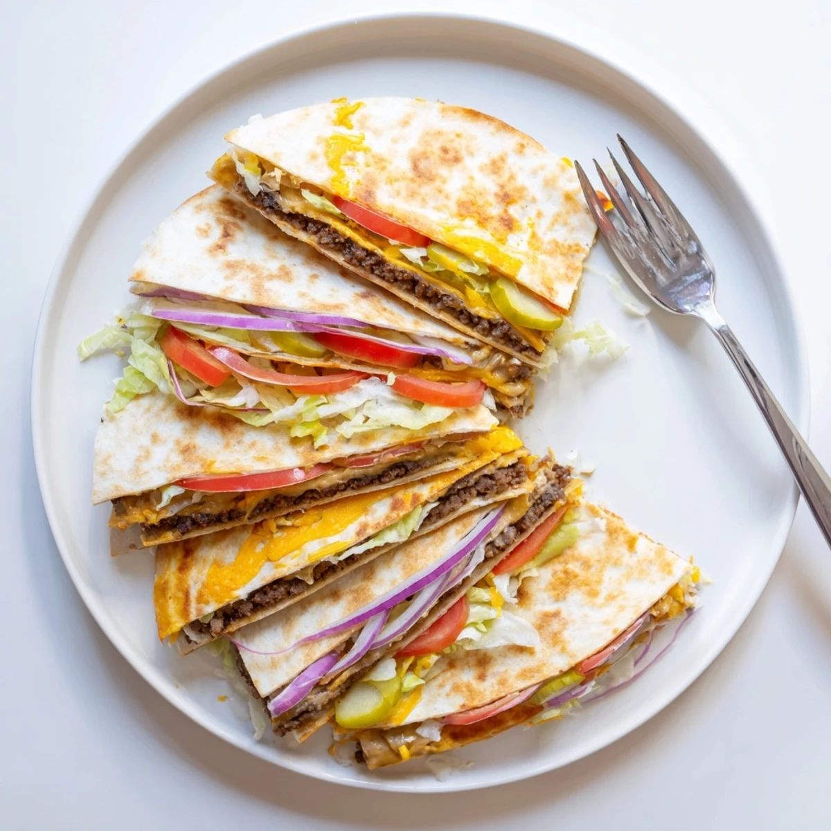 Crispy flour tortillas oozing with American-Mexican fusion Smashburger Quesadillas and fresh vegetable fixings