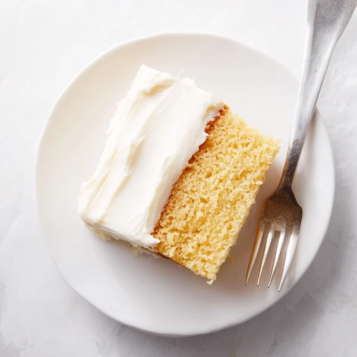 Homemade church cake with smooth buttercream frosting sliced for Sunday potluck gathering