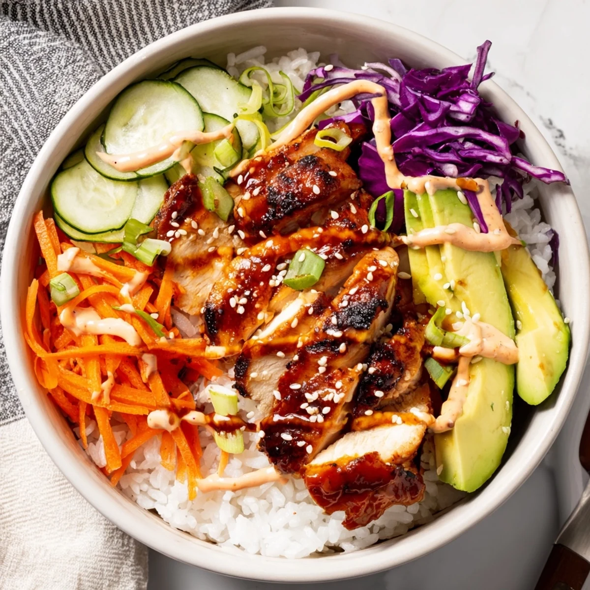 Glowing grilled Korean BBQ chicken bowl with colorful veggies, fluffy rice, and spicy gochujang mayo drizzle