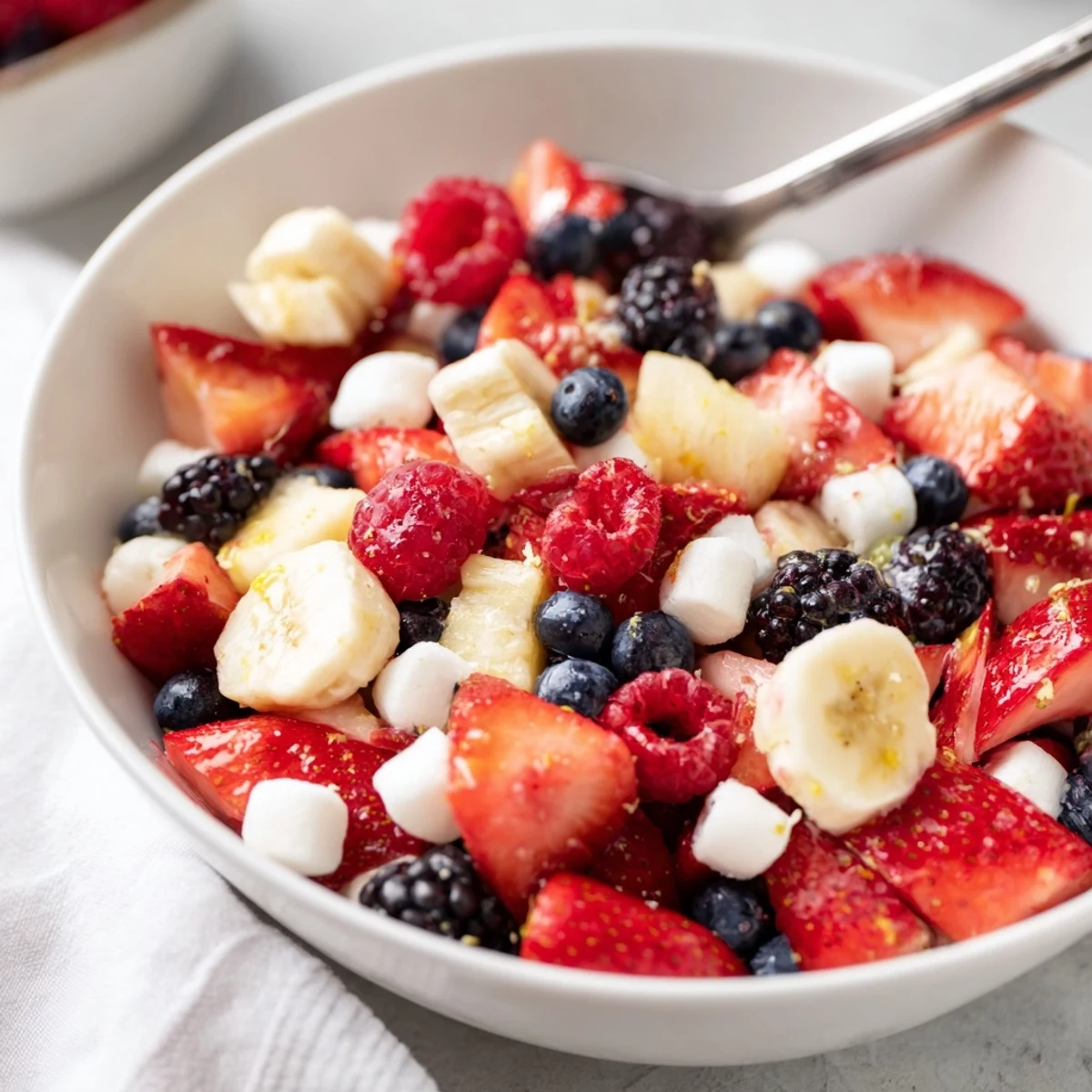 Bright Red White And Blue Fruit Salad served in bowl for summer gatherings
