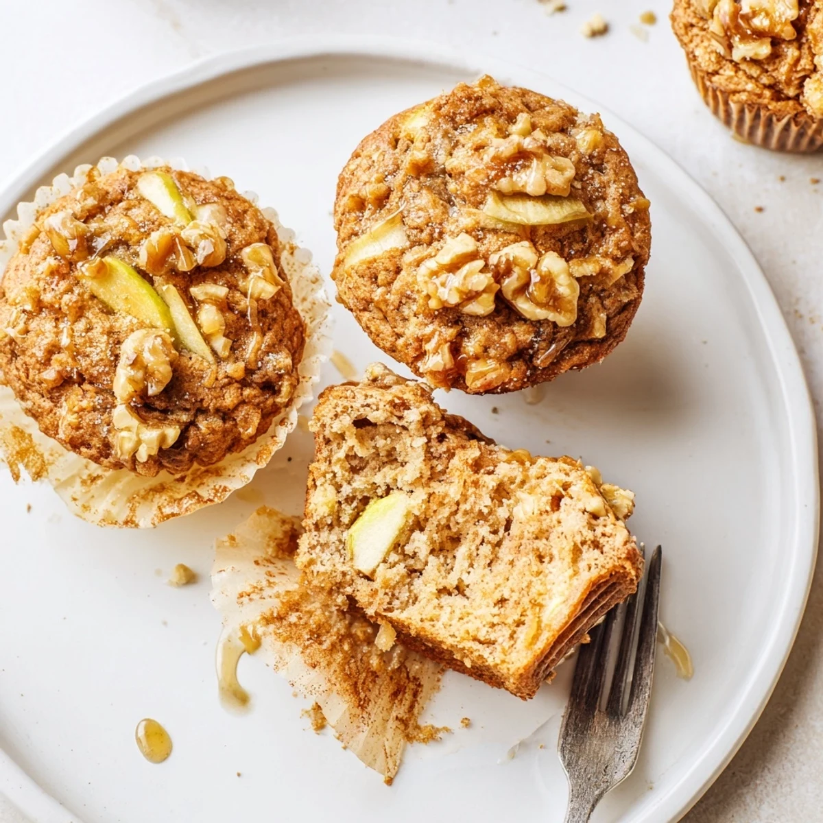 Warm Healthy Apple Cinnamon Greek Yogurt Muffins dotted with diced apples and nuts  