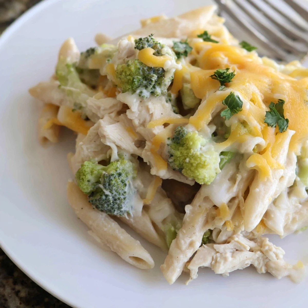 Oven-finished Chicken Broccoli Alfredo Bake Recipe, bubbling sauce and crisped edges