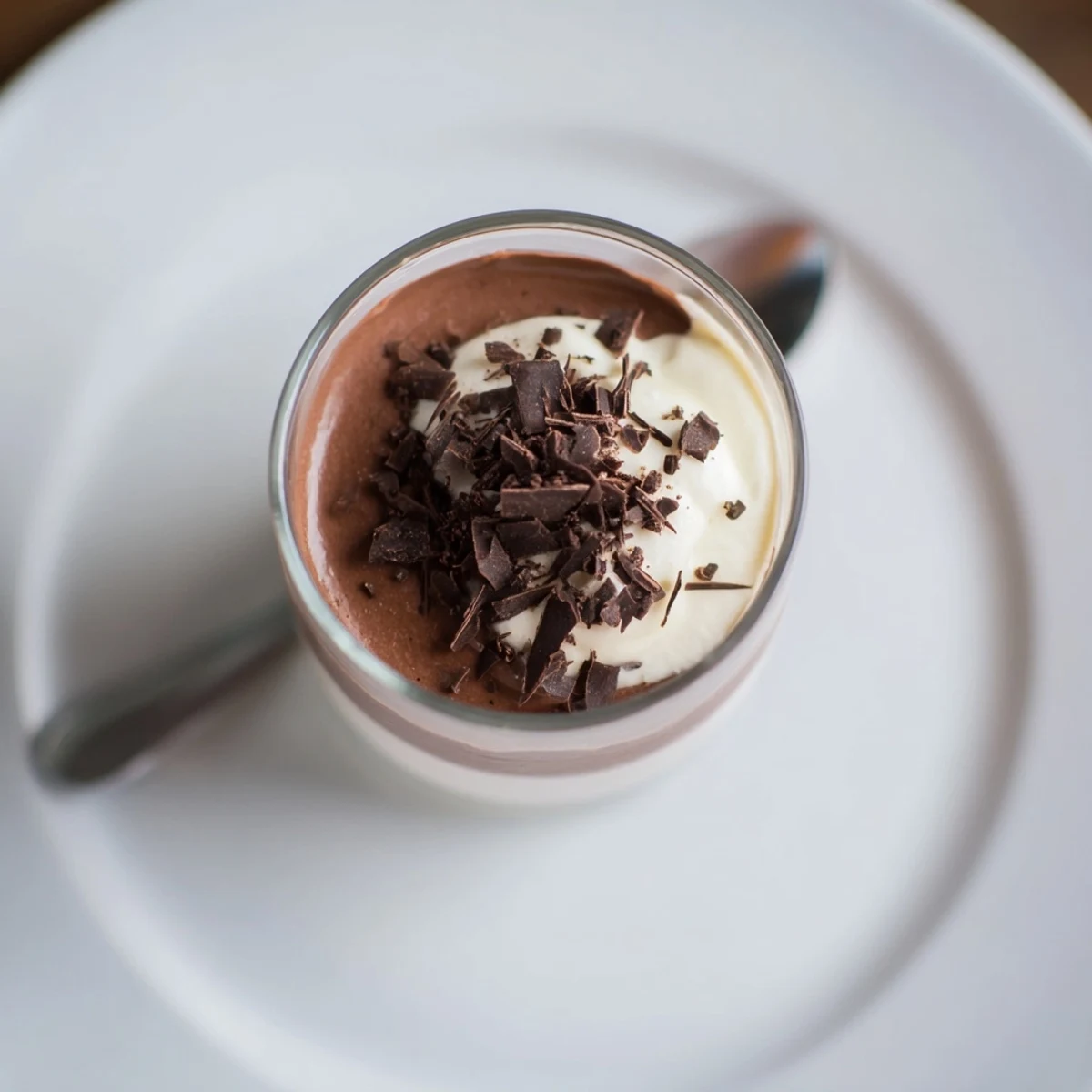 Close-up of Triple Chocolate Mousse Cups showing silky dark, milk, and white chocolate layers.