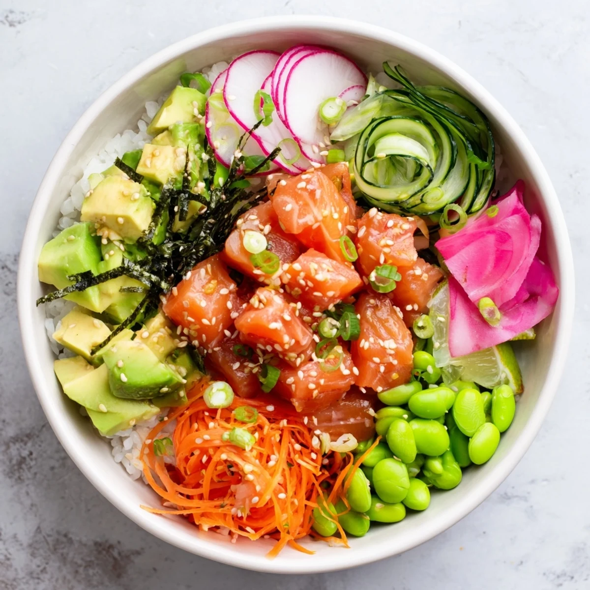 Fresh salmon and avocado poke bowl arranged in a bowl with sesame seeds