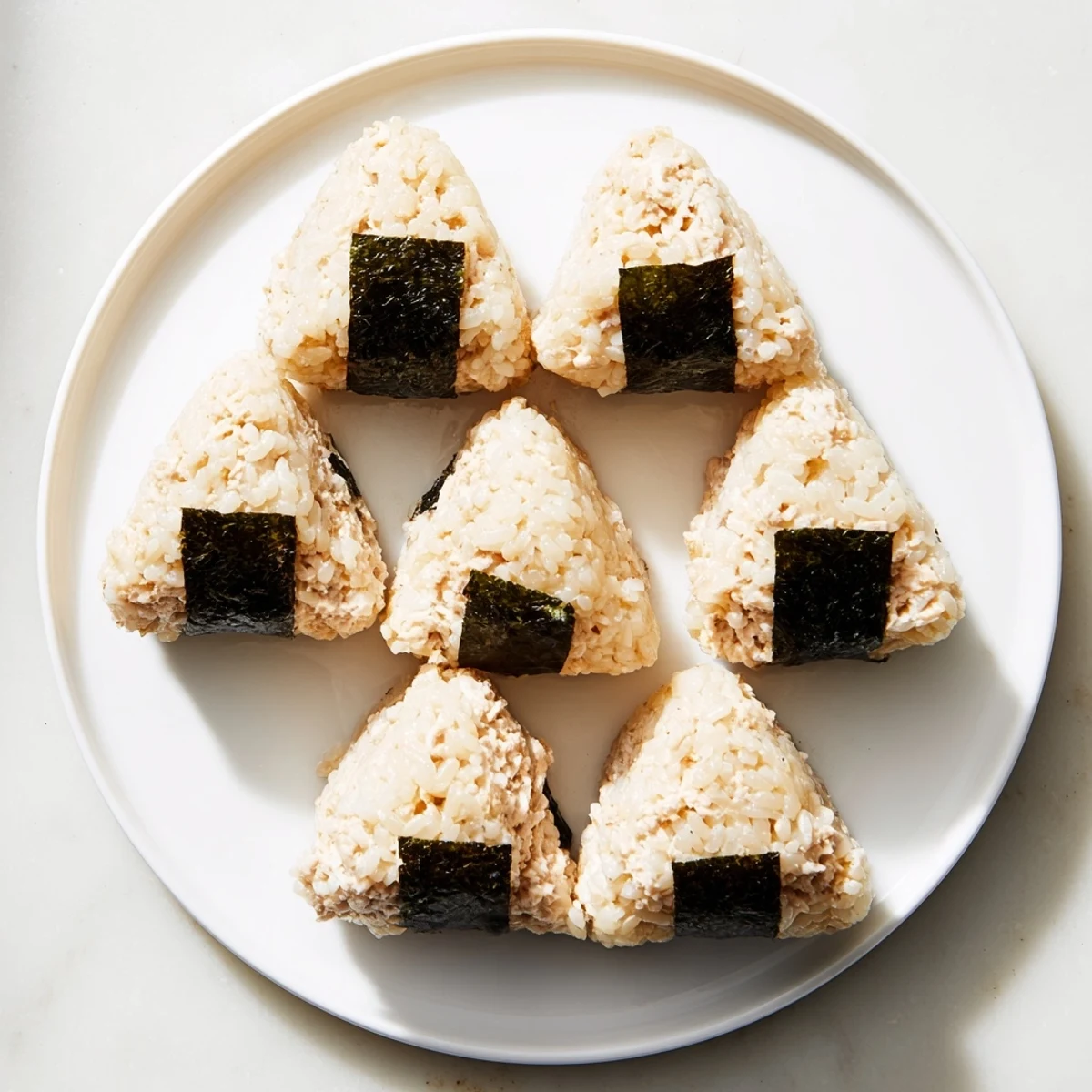 Hand-shaped tuna mayo onigiri wrapped in crispy nori seaweed sheets