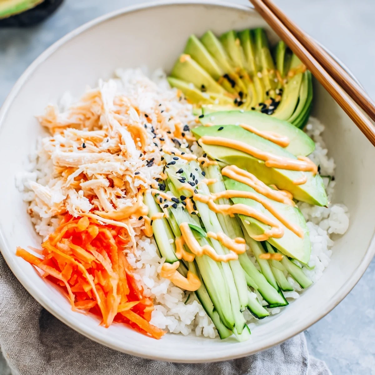 Vibrant California Roll Sushi Bowls served with pickled ginger and spicy mayo
